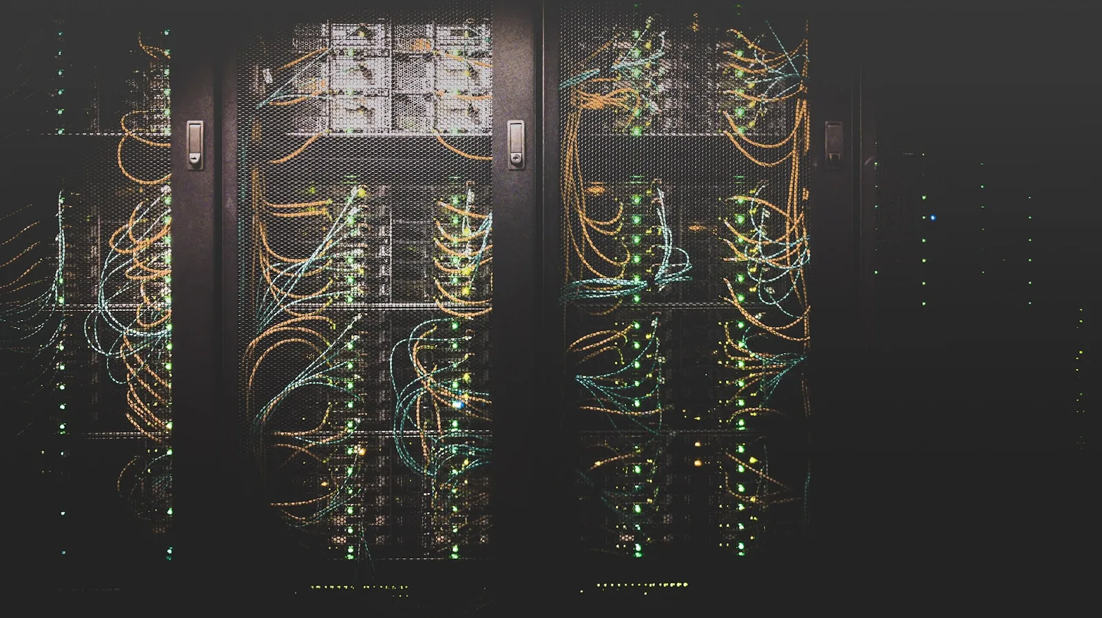Rows of illuminated enterprise servers in a data center